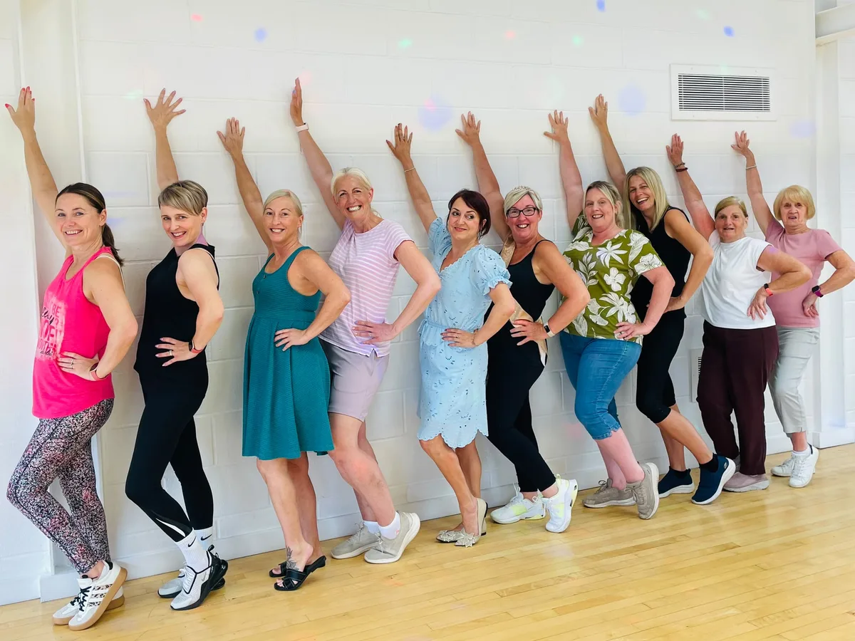 Hen party group mid-routine in their Flash Dance dance class